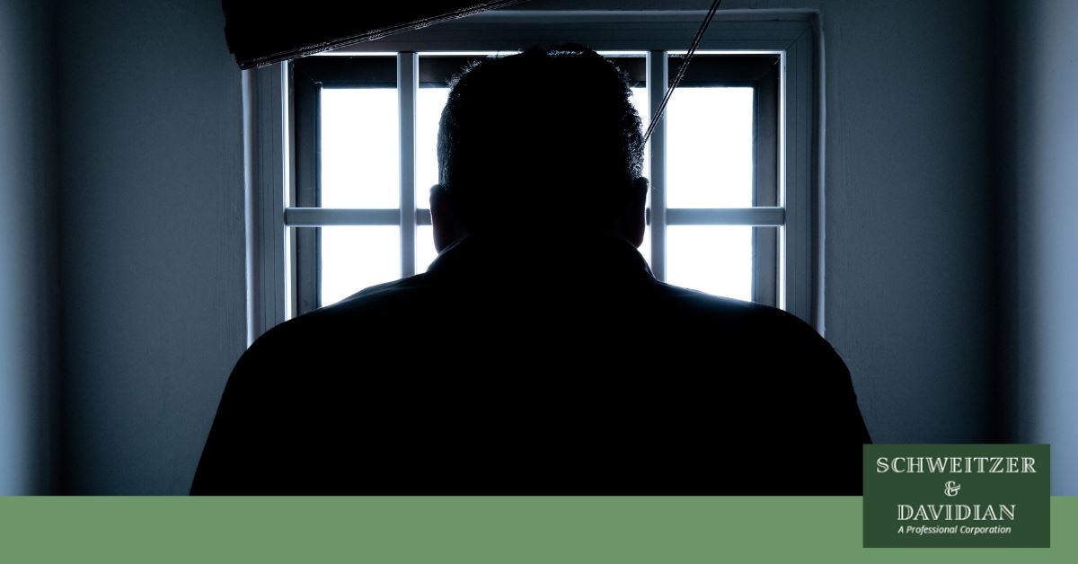 shadow of man in a jail cell